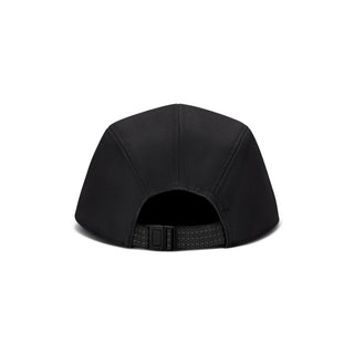 black Nike ACG Fly Unstructured Cap with a white embroidered ACG logo, holding the front of the bill.