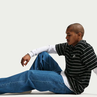 Nike SB Loose Denim Skate Pants in Blue with 100% cotton denim, loose fit through seat and thighs, interior drawcord, belt loops, five pocket silhouette, and Nike SB flag label