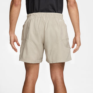 Nike ACG Dolomiti Corduroy Shorts in Lt Orewood Brown/Cinnamon — Dolomite-inspired corduroy with water-repellent finish, elastic waistband with belt, zip and snap closure, embroidered ACG and Swoosh logo
