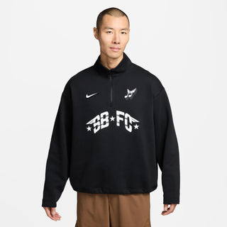 Man wearing a black Nike sweatshirt with white branding on a light gray background
