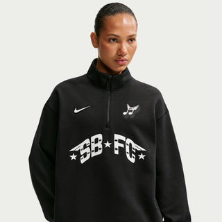 Nike SB Club 58 black half-zip fleece sweatshirt with adjustable hem and relaxed fit.