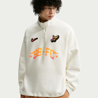 Person wearing a white sweatshirt with colorful branding on a light gray background