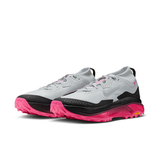 Nike ACG Zegama Trail GORE-TEX in Pure Platinum/Wolf Grey/Hyper Pink with grey laces, dark overlays, pink accents, and ACG insole branding.