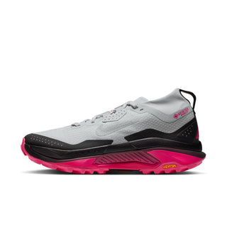 Nike ACG Zegama Trail GORE-TEX in Pure Platinum/Wolf Grey/Hyper Pink with grey laces, dark overlays, pink accents, and ACG insole branding.