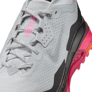 Nike ACG Zegama Trail GORE-TEX in Pure Platinum/Wolf Grey/Hyper Pink with grey laces, dark overlays, pink accents, and ACG insole branding.