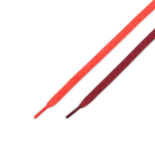 Nike SB P-Rod Zoom Air Low in habanero red and club gold with burgundy accents and metallic lace detail.