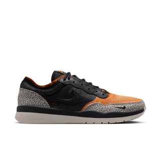 Sneaker with black, orange, and gray pattern on a white background