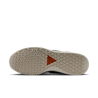 Sole of a shoe with a brand logo on a white background