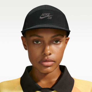 Nike SB Unstructured Skate Cap in Black — heavyweight 100% cotton, 5-panel design, adjustable webbed strap, embroidered eyelets, low-profile athletic fit