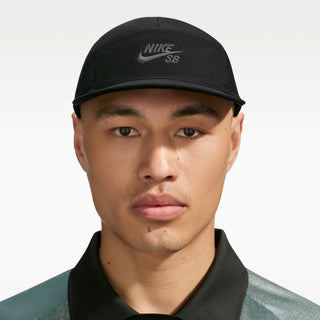 Nike SB Unstructured Skate Cap in Black — heavyweight 100% cotton, 5-panel design, adjustable webbed strap, embroidered eyelets, low-profile athletic fit