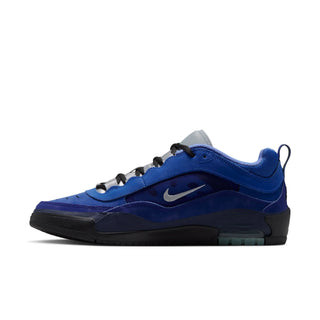 A Nike Air Max 90 sneaker in a blue and black colorway, featuring a blue suede and synthetic upper, black laces, a black sole, and a silver Nike Swoosh on a white background.