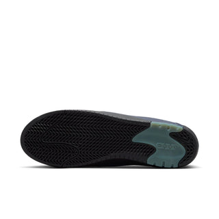 The outsole of a shoe shown from a bottom-up view, featuring a black textured tread pattern with a translucent light teal heel section.