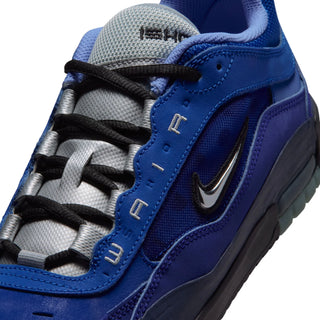 Close-up of a Nike sneaker in royal blue and silver, featuring black laces, a metallic silver Swoosh, and 'AIR' lettering on the side.