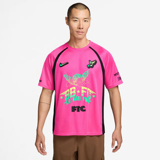 Person wearing a white sports jersey with various logos and text on a Hyper Pink Background