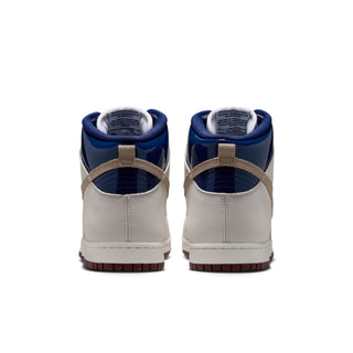 Nike SB Dunk High Pro x Beyond Store Skate Shoes in White/Ivory-Sand Dune-Blue Void — premium leather upper, kidney pool blueprint sockliner, perforated toe box, and full cupsole rubber sole. Extra laces included.