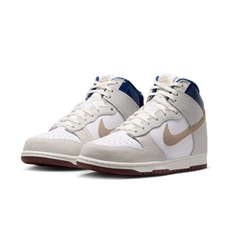 Nike SB Dunk High Pro x Beyond Store Skate Shoes in White/Ivory-Sand Dune-Blue Void — premium leather upper, kidney pool blueprint sockliner, perforated toe box, and full cupsole rubber sole. Extra laces included.
