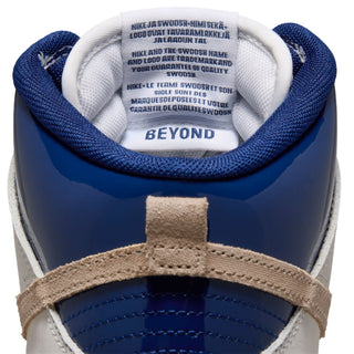 Nike SB Dunk High Pro x Beyond Store Skate Shoes in White/Ivory-Sand Dune-Blue Void — premium leather upper, kidney pool blueprint sockliner, perforated toe box, and full cupsole rubber sole. Extra laces included.