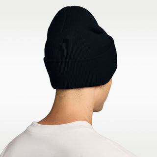“Black Nike SB Peak knit beanie with a folded cuff and white embroidered Nike SB logo.”