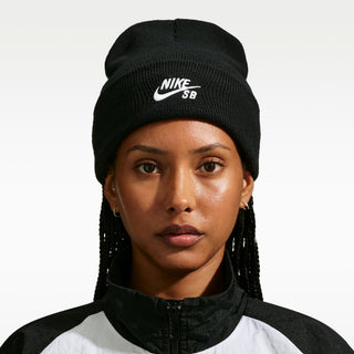 “Black Nike SB Peak knit beanie with a folded cuff and white embroidered Nike SB logo.”