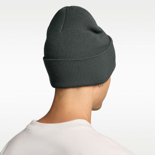 Model wearing the Nike SB Peak Skate Beanie in Camo Green with a folded cuff and white embroidered Nike SB logo