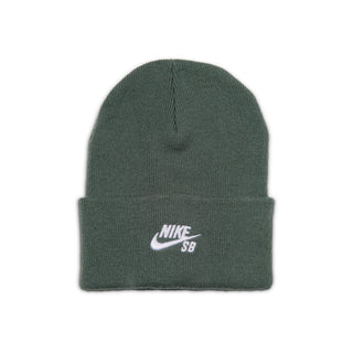 Model wearing the Nike SB Peak Skate Beanie in Camo Green with a folded cuff and white embroidered Nike SB logo