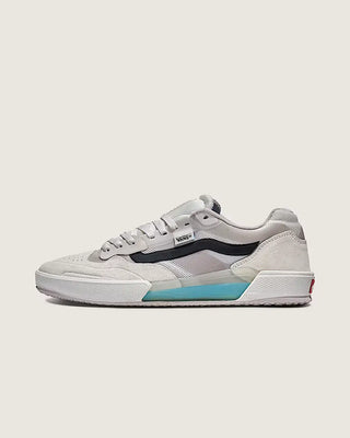 White sneakers with black and blue accents on a light gray background