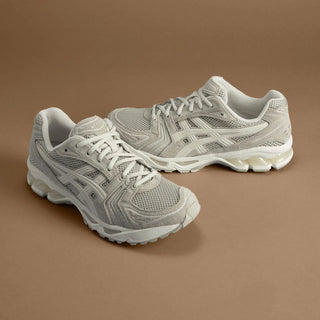 ASICS GEL-KAYANO® 14 Simply Taupe/Oatmeal running shoe with 2000s retro aesthetic, featuring GEL™ technology cushioning and TRUSSTIC™ support system.