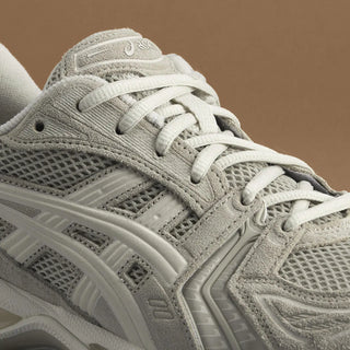 ASICS GEL-KAYANO® 14 Simply Taupe/Oatmeal running shoe with 2000s retro aesthetic, featuring GEL™ technology cushioning and TRUSSTIC™ support system.