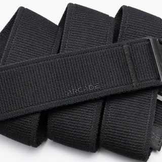 Arcade Atlas Stretch Belt in Black with patented A2 buckle, performance stretch, and sustainable REPREVE®️ material.