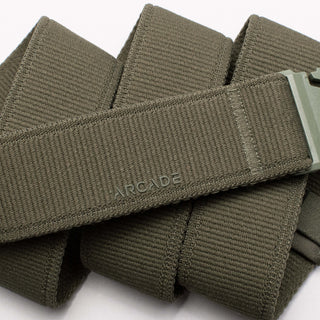 Arcade Belts Inc Atlas Stretch Belt in Ivy Green with patented A2 buckle, performance stretch, and sustainable REPREVE®️ material.