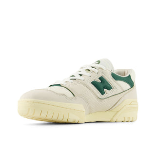 New Balance 550 sneaker in Permafrost and Dark Alpine Green with leather upper, rubber outsole, and retro low-top style.