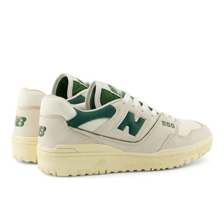 New Balance 550 sneaker in Permafrost and Dark Alpine Green with leather upper, rubber outsole, and retro low-top style.