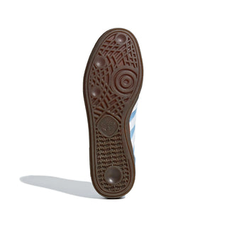 Close-up of a shoe sole with a brand logo on a white background