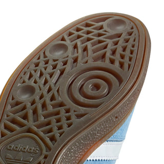 Close-up of Adidas shoe sole with pattern and brand logo.