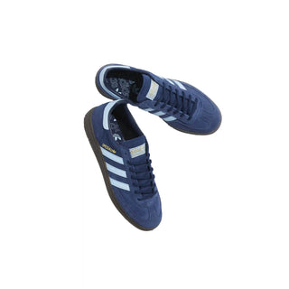 Blue Adidas sneakers with white stripes on a white background
