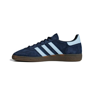 Navy blue Adidas sneaker with white stripes on a white background