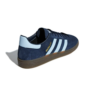 Navy blue Adidas sneaker with white stripes on a white background