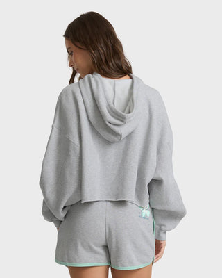 Billabong cropped heather gray hoodie with boxy fit, drawcord hood, ribbed trims, and front graphic detail.