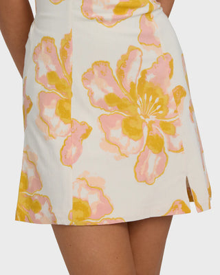 Floral patterned skirt with pink and yellow flowers on a white background