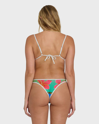 Woman wearing a colorful bikini with a white background