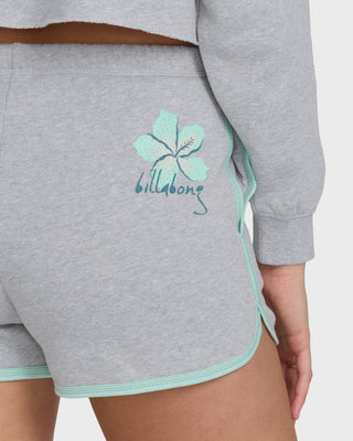 Billabong heather gray fleece shorts with dolphin hem, contrast trim, elastic waistband, and soft fabric construction.
