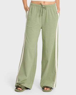 Billabong Wave Stamp Knit Pants in Army Green — wide leg mid-rise fit with elastic drawcord waist and contrast side taping in 100% cotton jersey knit
