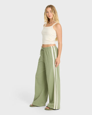 Billabong Wave Stamp Knit Pants in Army Green — wide leg mid-rise fit with elastic drawcord waist and contrast side taping in 100% cotton jersey knit