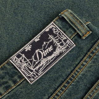 Dime Baggy Denim Pants in Sandblasted Pine with wavy back pockets and embroidered logos.