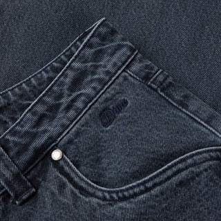 Overdyed blue Dime baggy denim pants with loose fit, classic five-pocket style, and subtle embroidered branding.
