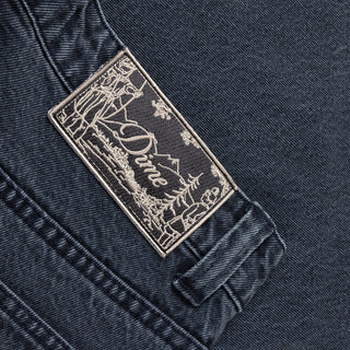 Overdyed blue Dime baggy denim pants with loose fit, classic five-pocket style, and subtle embroidered branding.
