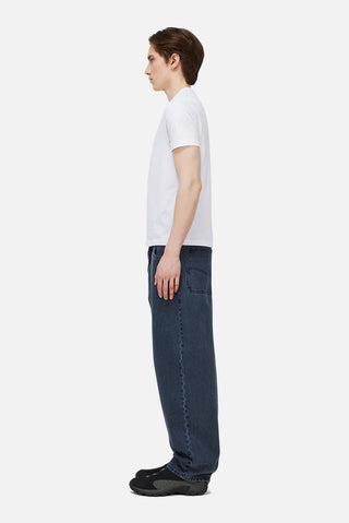 Overdyed blue Dime baggy denim pants with loose fit, classic five-pocket style, and subtle embroidered branding.
