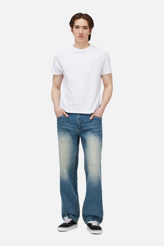 Sandblasted indigo Dime relaxed denim pants with faded wash, straight leg fit, and subtle embroidered branding.
