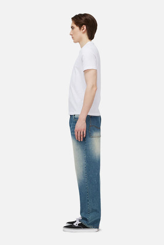 Sandblasted indigo Dime relaxed denim pants with faded wash, straight leg fit, and subtle embroidered branding.
