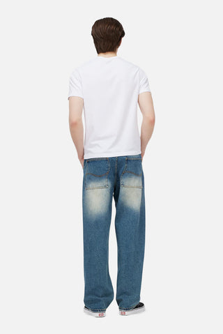 Sandblasted indigo Dime relaxed denim pants with faded wash, straight leg fit, and subtle embroidered branding.

